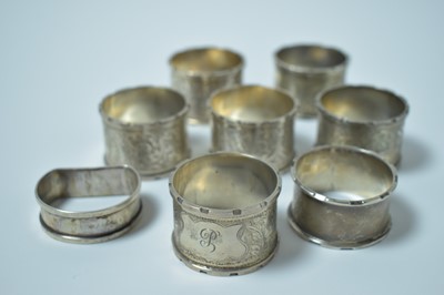 Lot 132 - A set of six silver napkin rings and two further.