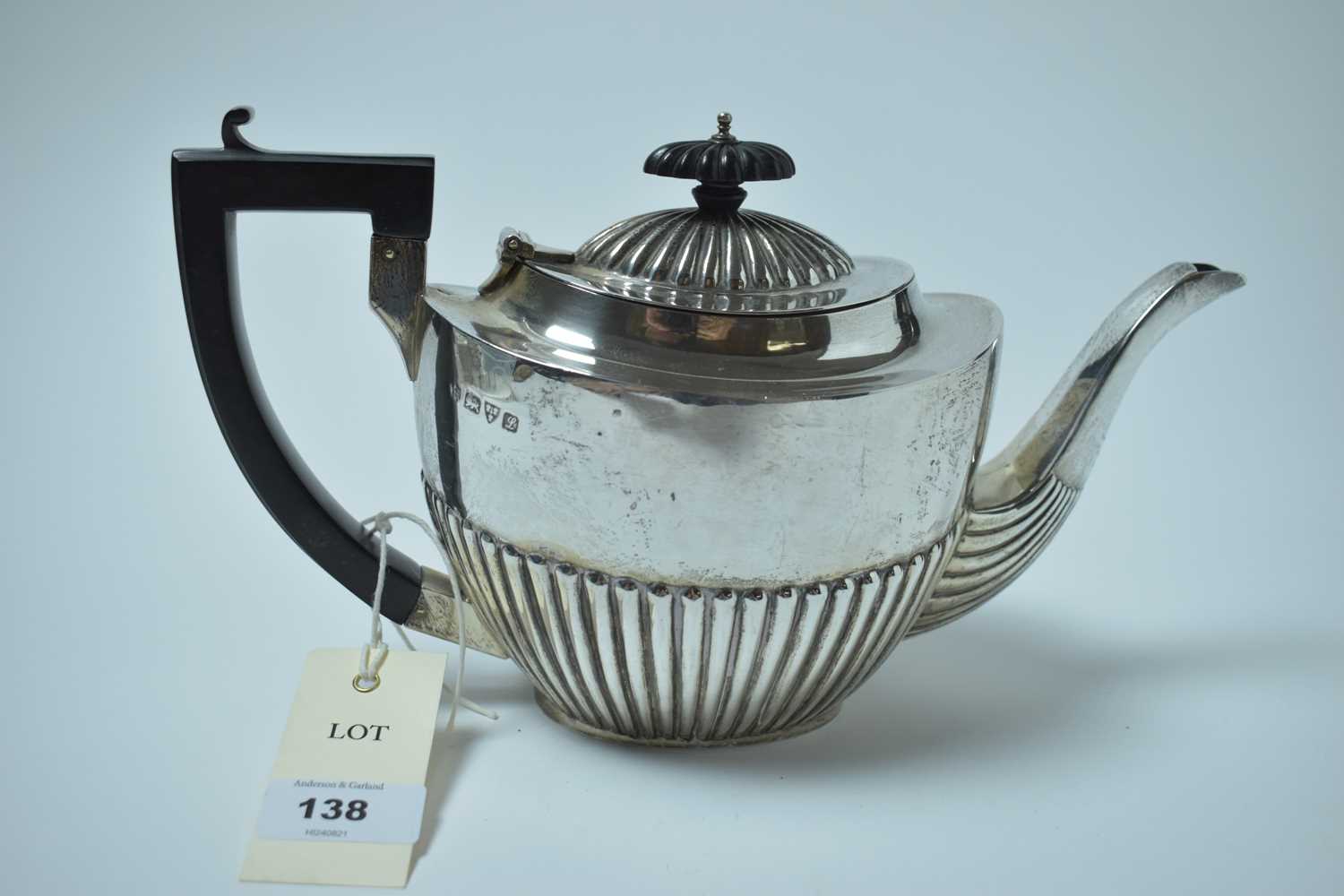 Lot 138 - A George V silver tea pot.