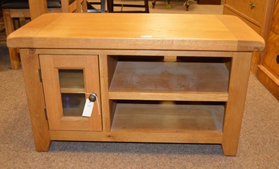 Lot 123 - A group of oak occasional furniture, comprising coffee table, TV cabinet and side table