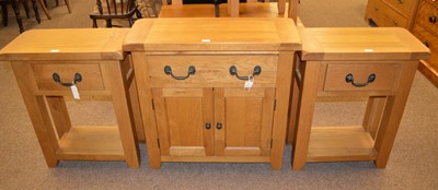 Lot 124 - A group of three 20th Century oak occasional furniture - two side tables and a side cabinet