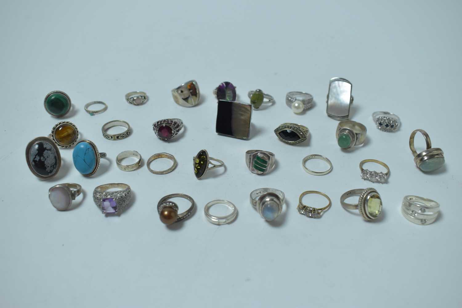 Lot 195 - A large collection of contemporary white metal and semi-precious gemstone rings