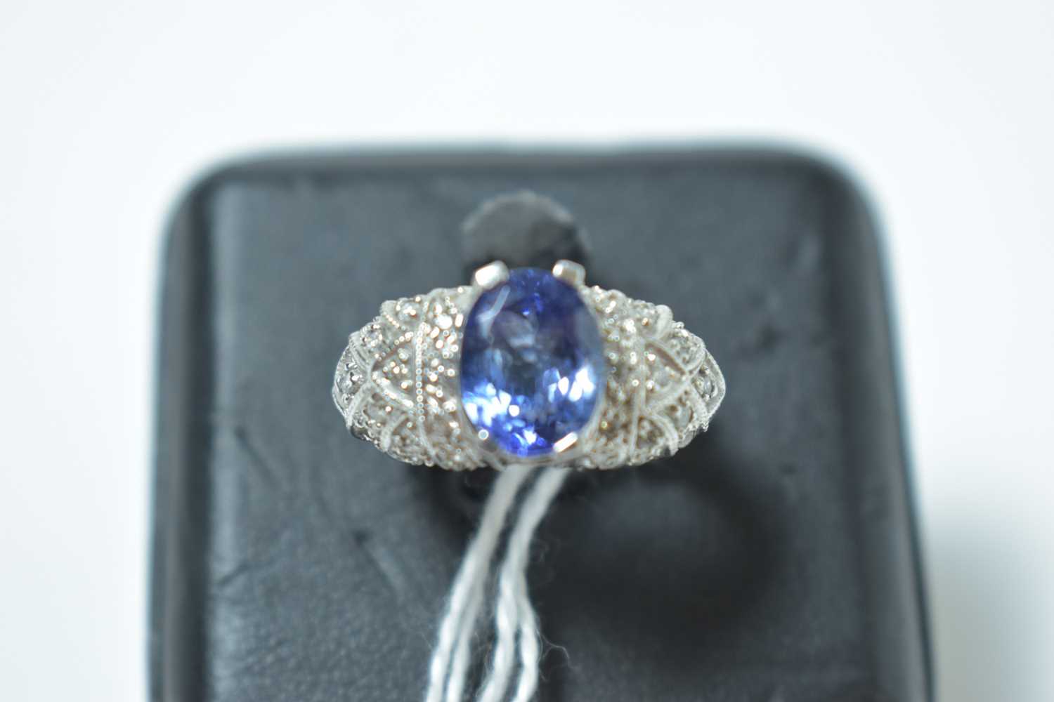 Lot 228 - A contemporary white metal, tanzanite and diamond cocktail ring