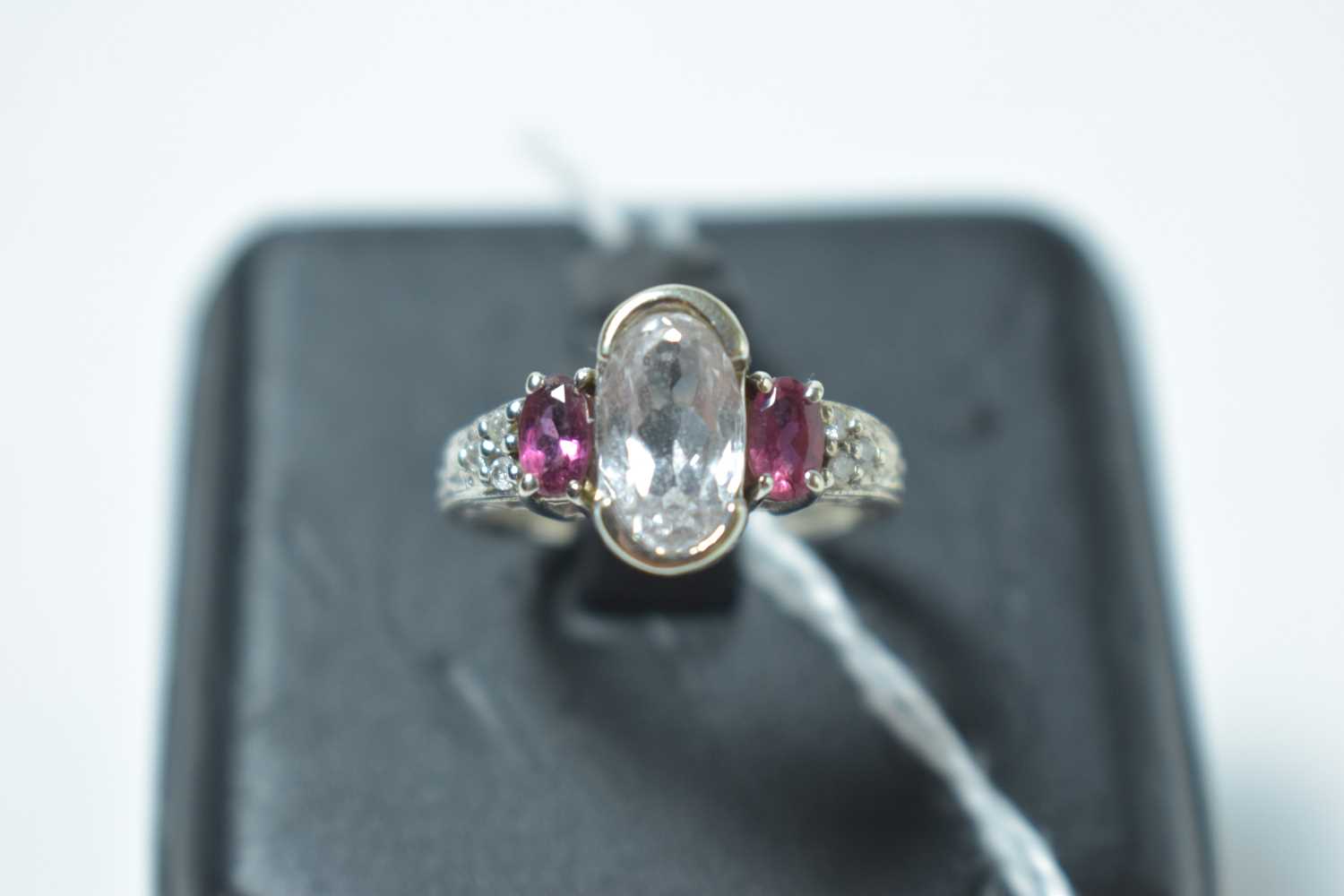 Lot 223 - A contemporary 14ct white gold, white sapphire, ruby and diamond ring