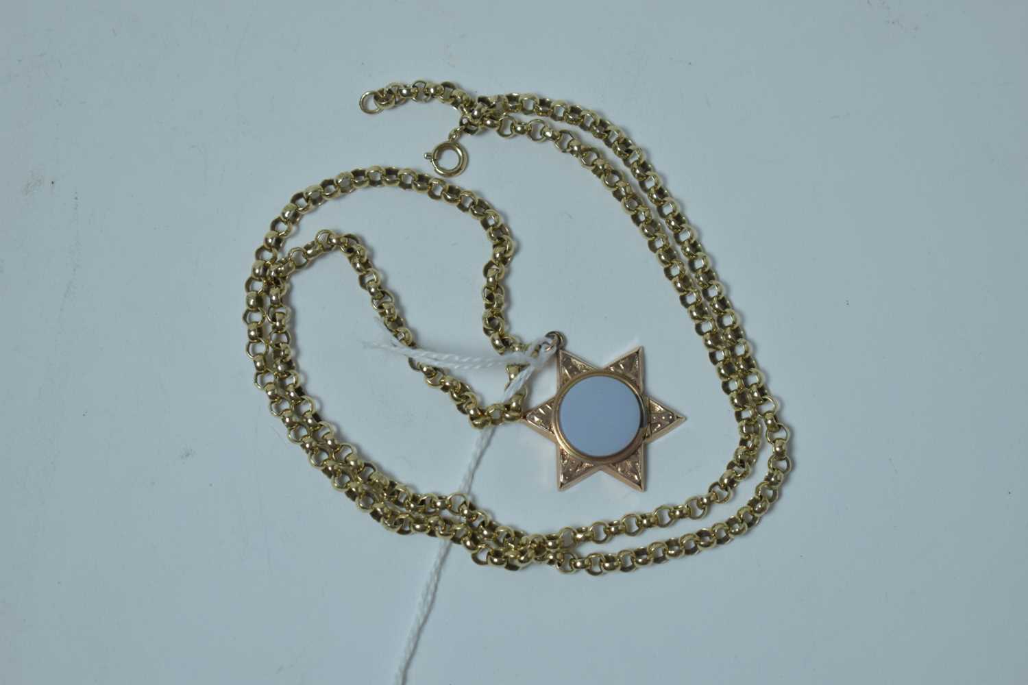 Lot 206 - A 19th Century locket pendant on later yellow metal chain
