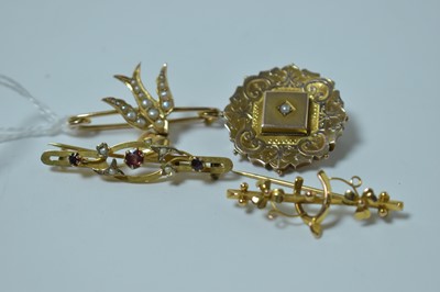 Lot 234 - Four Edwardian brooches