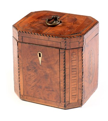 Lot 584 - A George III marquetry inlaid flame mahogany tea caddy.