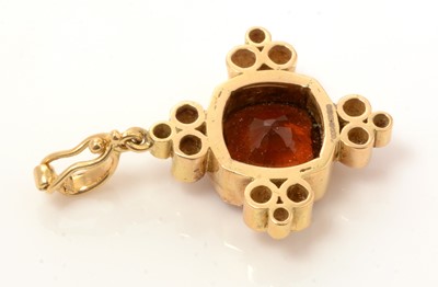 Lot 73 - An Imperial Topaz and diamond pendant