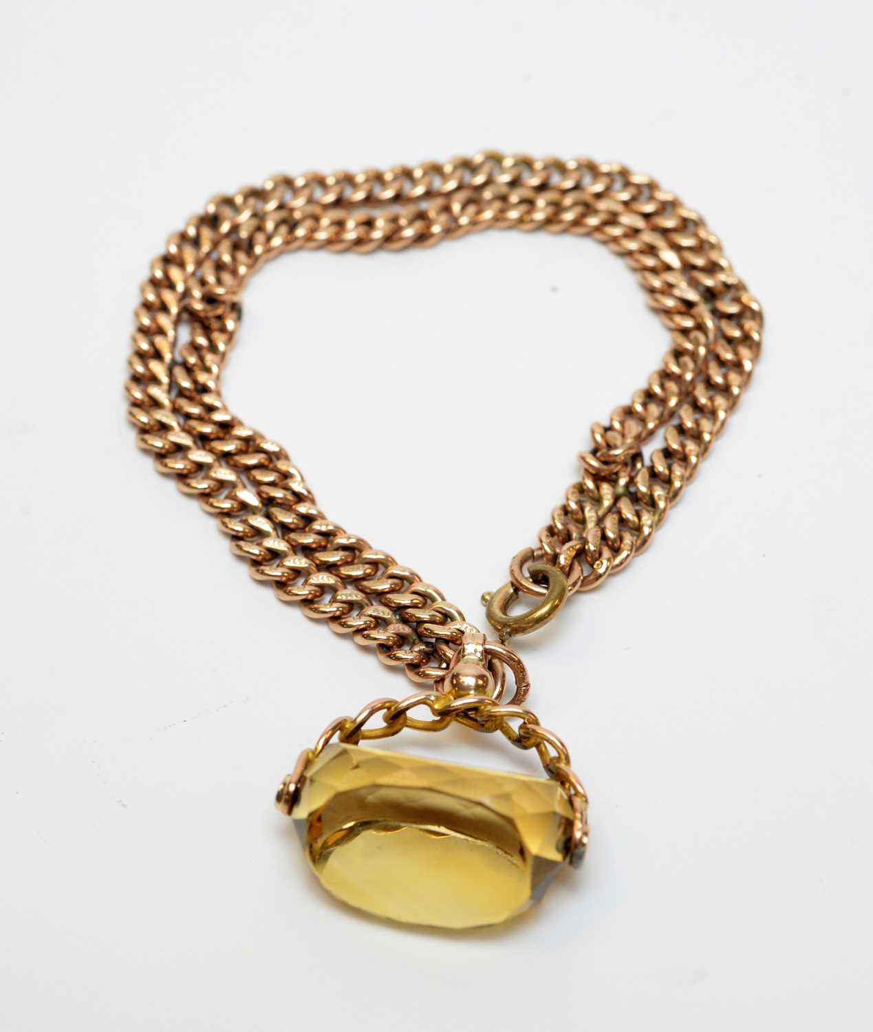 Lot 14 - An antique 9ct gold watch chain bracelet with citrine fob seal charm.