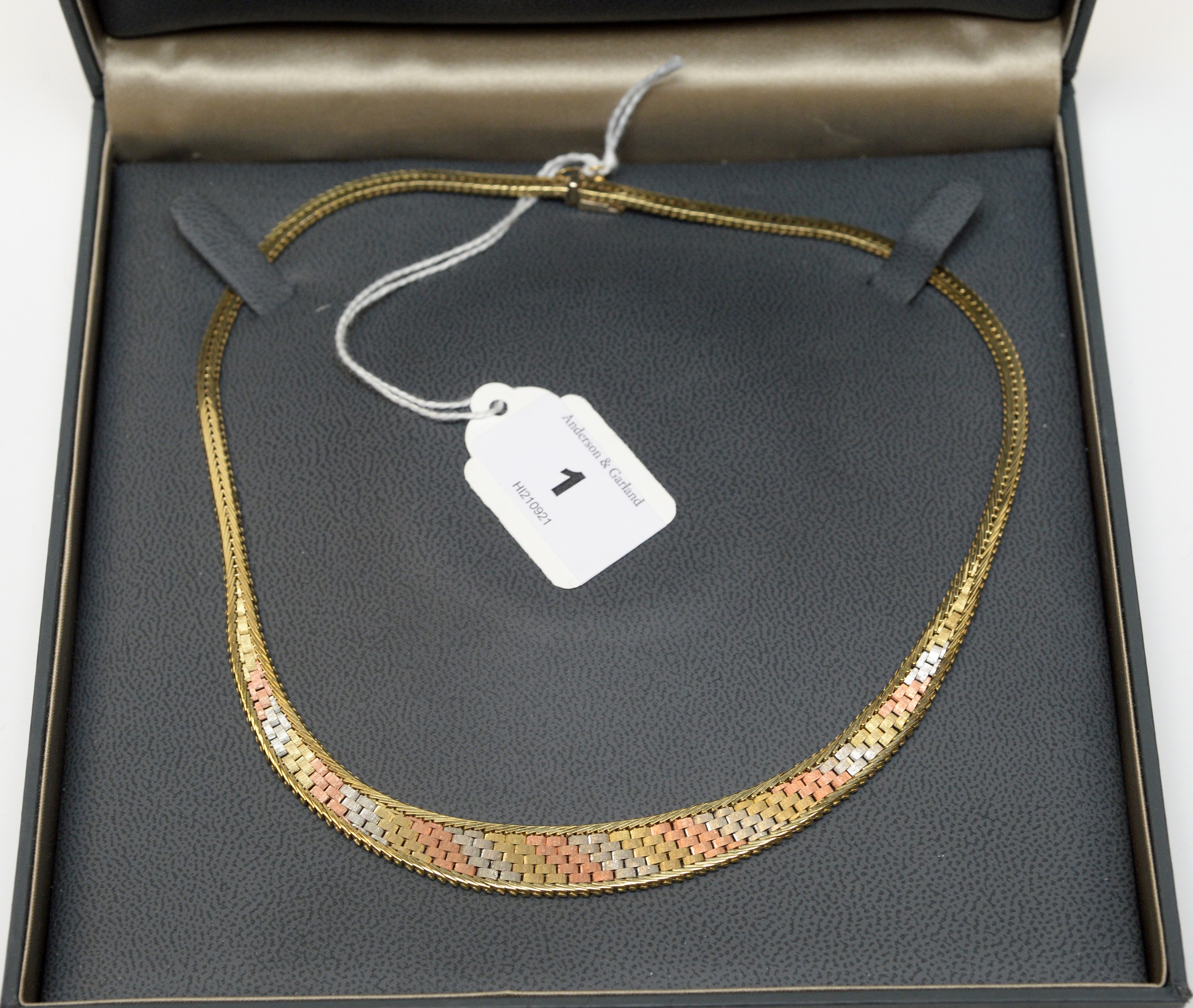 Lot 1 - A 9ct gold tri-coloured collar necklace.