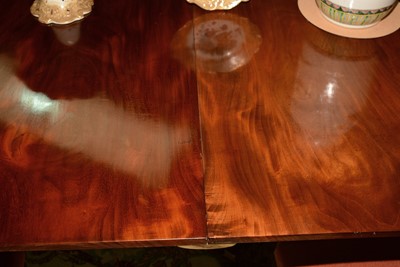 Lot 666 - Early 20th Century mahogany triple pedestal dining table