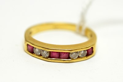 Lot 131 - A contemporary 18ct gold, ruby, and diamond ring.
