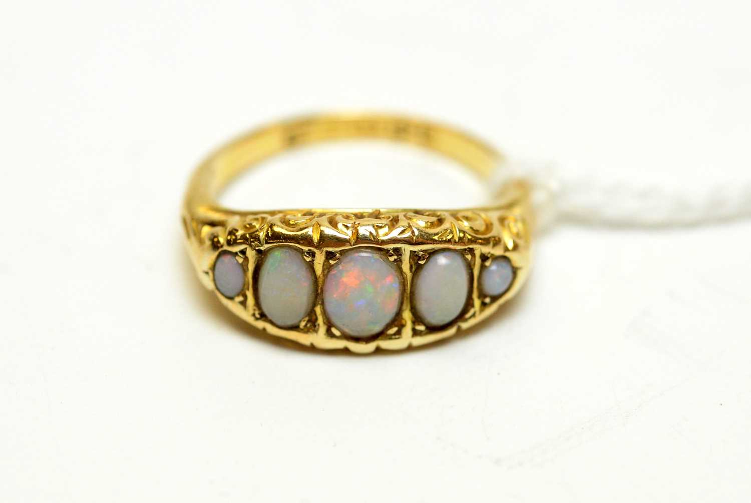 Lot 130 - An antique 18ct gold and opal dress ring.