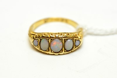 Lot 130 - An antique 18ct gold and opal dress ring.