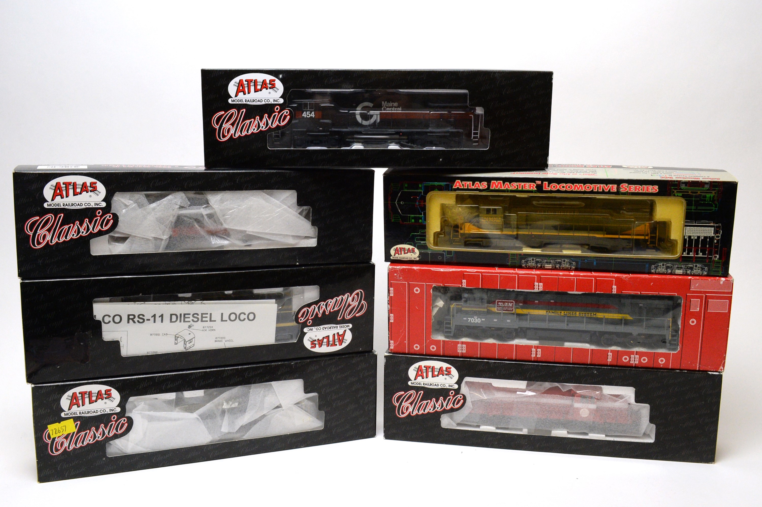 Lot 620 Seven boxed Atlas HOgauge trains.