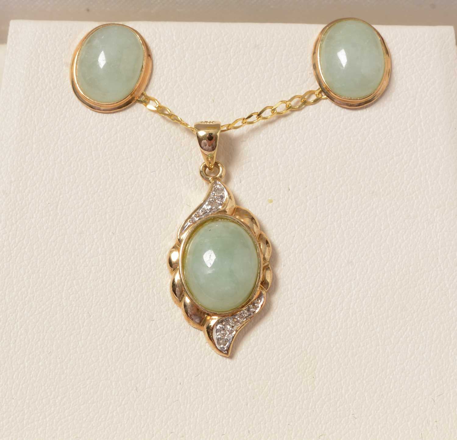 Lot 256 - A 9ct gold, diamond and jade coloured stone pendant necklace and earring set.