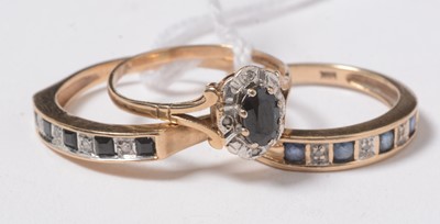 Lot 250 - Three sapphire and diamond rings.