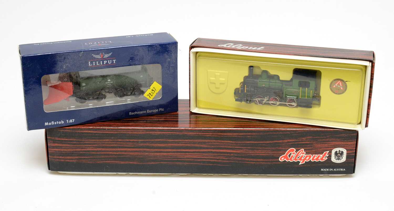 Lot 650 - Three boxed Liliput locomotives and rolling stock.