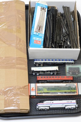Lot 764 - Unboxed N-gauge trains, carriages and rolling stock; and a qty. of track.