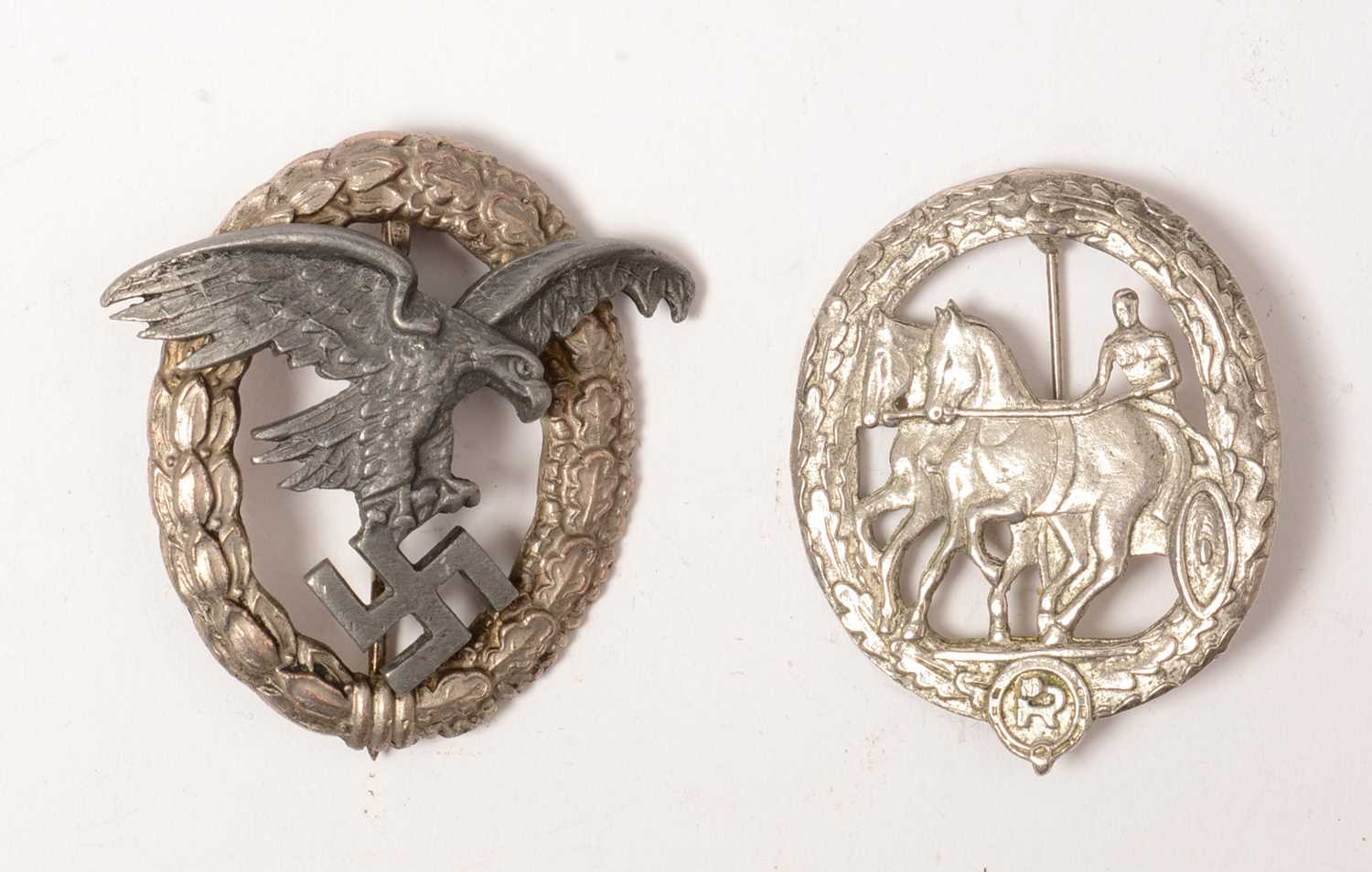 Lot 1024 - Two reproduction WWII German award badges