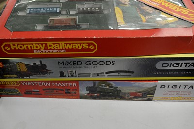 Lot 875 - Three boxed Hornby 00-gauge trains sets, and other items.