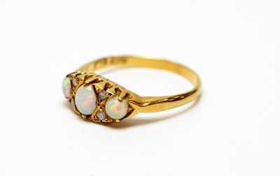 Lot 9 - An 18ct gold, diamond and opal dress ring.
