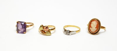 Lot 10 - Four gold dress rings.