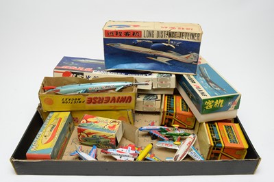 Lot 915 - A quantity of boxed and unboxed scale model tinplate aircraft.