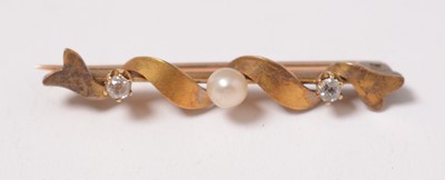 Lot 223 - An early 20th Century diamond, pearl, and yellow-metal bar brooch.