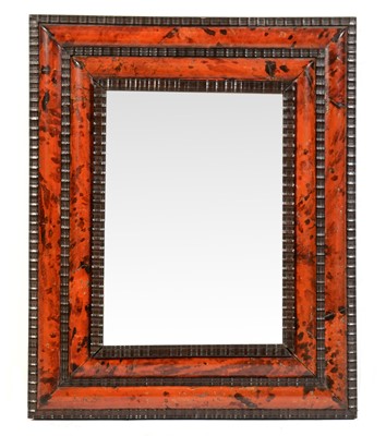 Lot 506 - A faux tortoiseshell and ebonised rectangular wall mirror