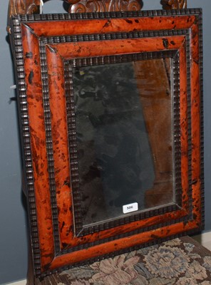Lot 506 - A faux tortoiseshell and ebonised rectangular wall mirror