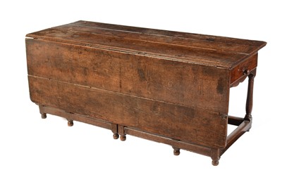 Lot 540 - An substantial oak  rustic gateleg dining table