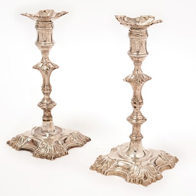 Lot 170 - A matched pair of George II cast silver candlesticks