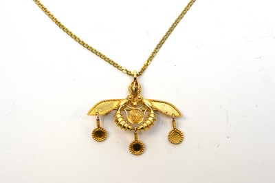 Lot 147 - A high carat yellow metal pendant brooch on chain.