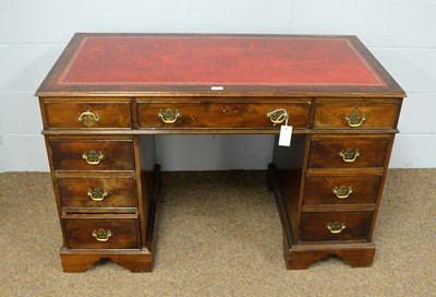 Lot 8 - An early 20th Century stained pine writing desk.