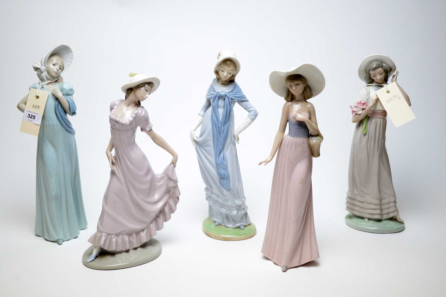 Lot 325 - A selection of five Nao figures of ladies.