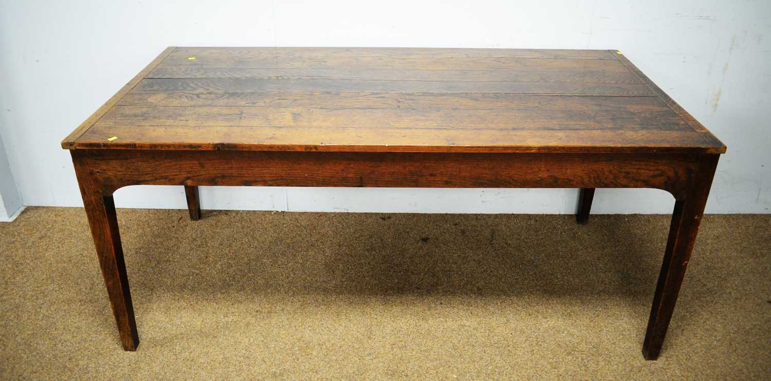 Lot 16 - A substantial 18th C style oak plank top dining table.