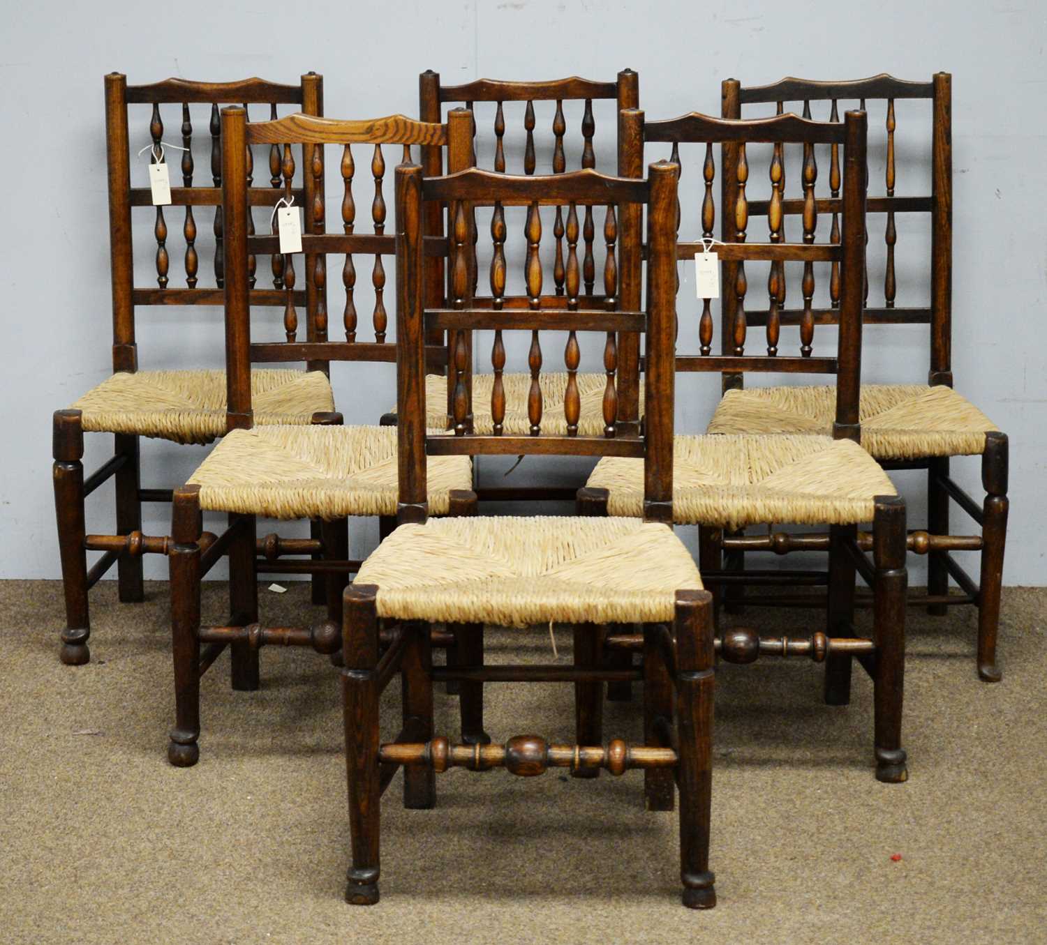 Lot 11 - 19th C Harlequin set of six spindle back and rush seat dining chairs.