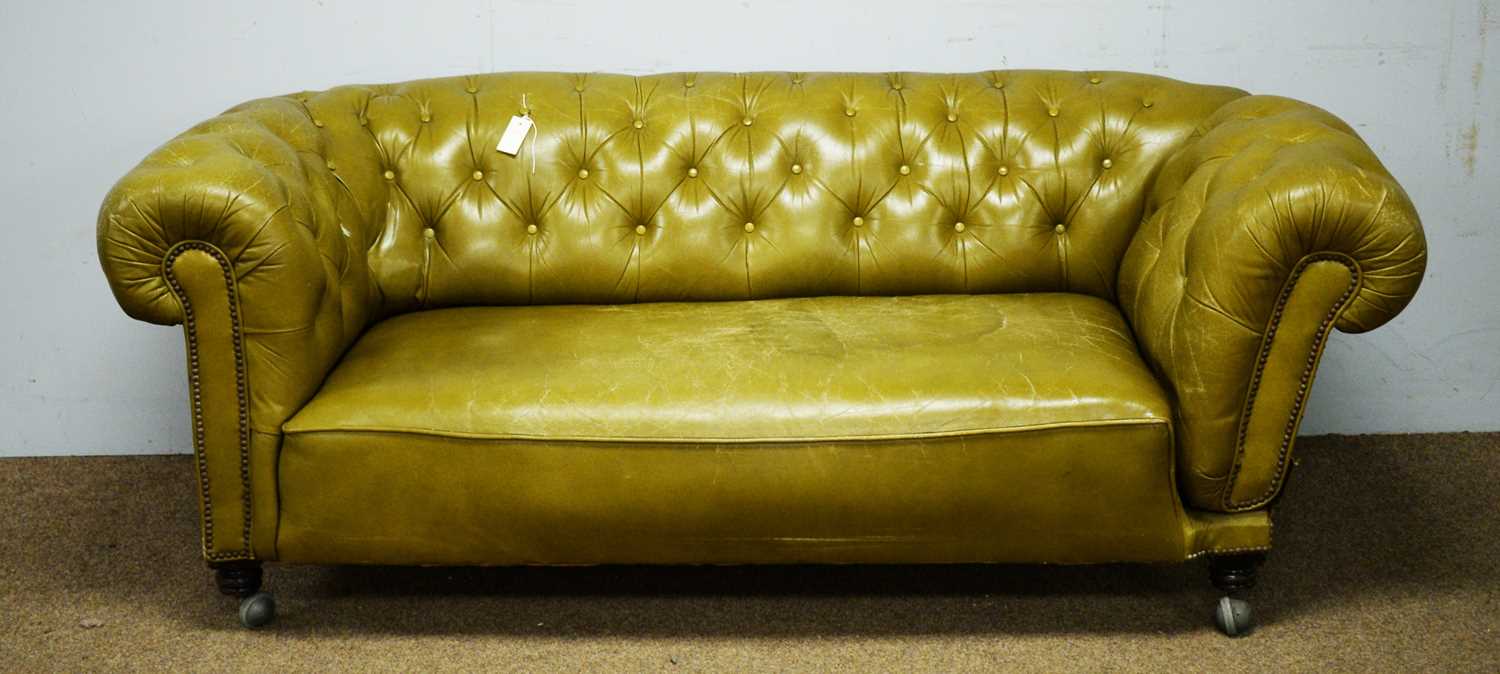 Lot 6 - A late Victorian green buttoned and studded leather drop-end Chesterfield sofa.