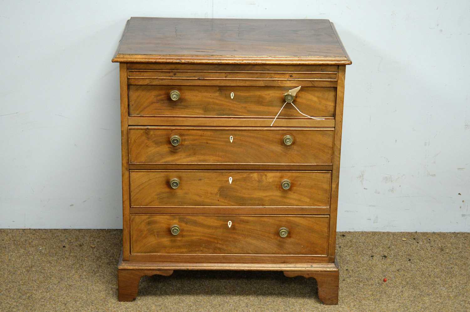 Lot 47 - A mahogany four drawer chest.