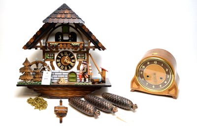 Lot 311 - German cuckoo clock; and an Art Decom domed mantel clock.