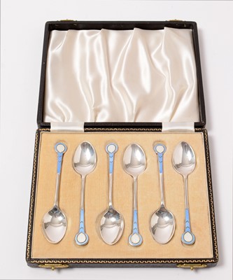 Lot 194 - A cased set of six enamelled silver coffee spoons.