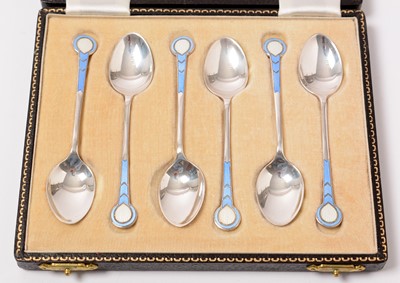 Lot 194 - A cased set of six enamelled silver coffee spoons.