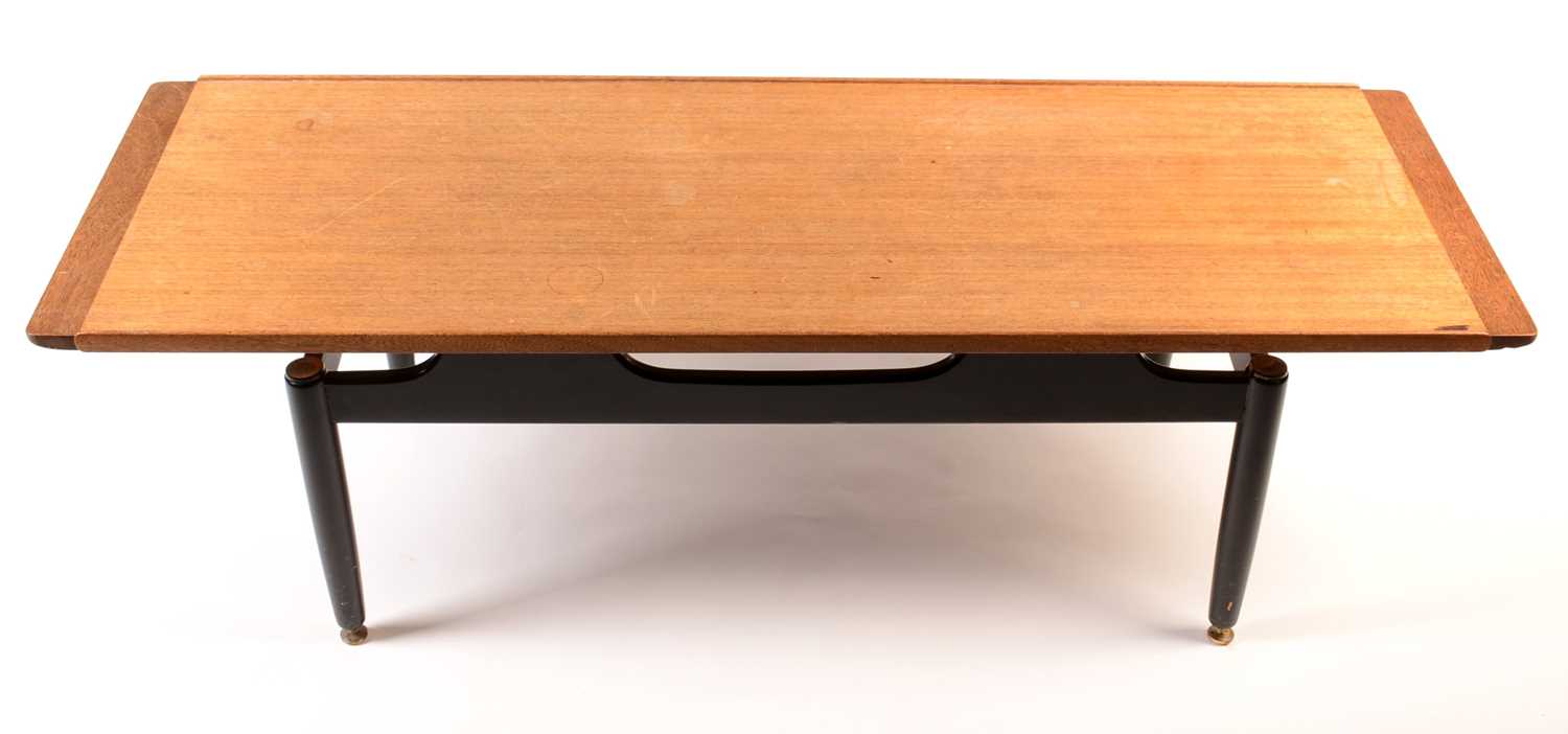 Lot 62 - G-Plan E Gomme: a tola and black 'Librenza coffee table.