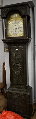 Lot 120 - Georgian carved oak longcase clock.