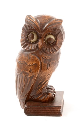 Lot 499 - An early 20th Century German Black Forrest owl pattern clock
