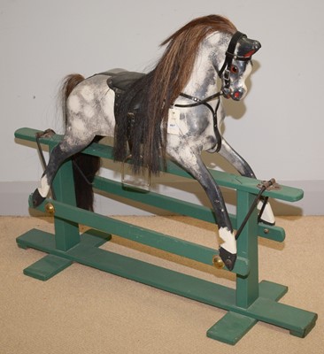 Lot 487 - A 20th Century carved greyed apple rocking horse.