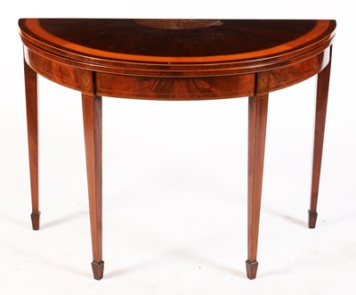 Lot 571 - A George III mahogany and satinwood banded demi lune card table