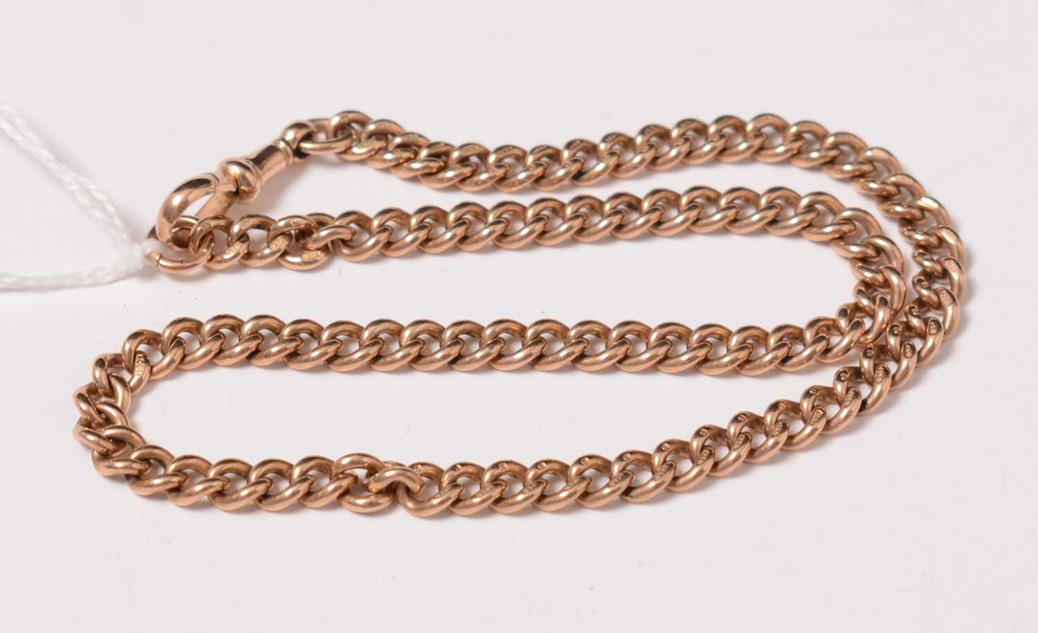 Lot 224 - A 9ct gold curb-link Albert watch chain.
