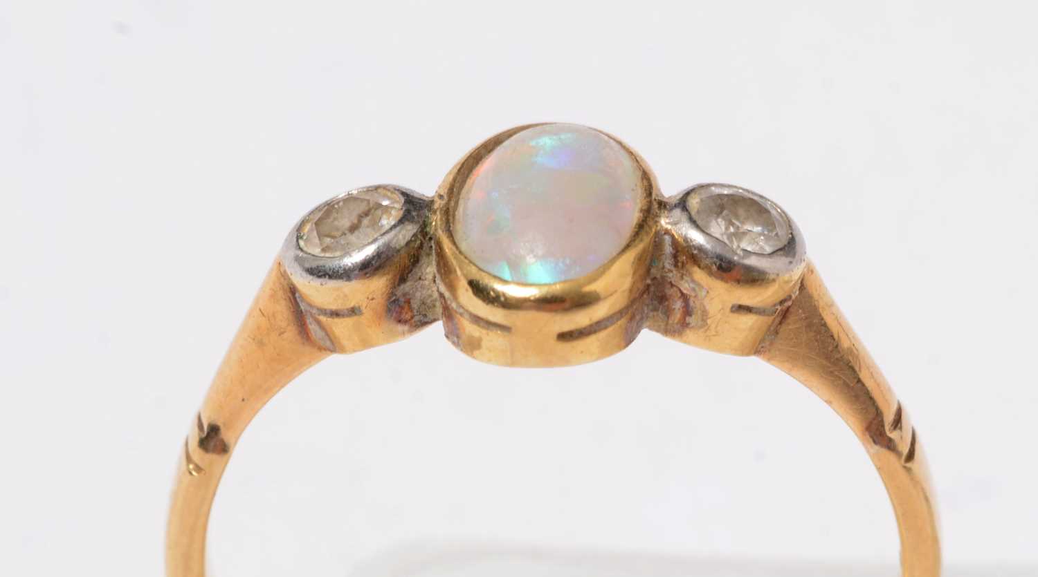Lot 229 - A yellow-metal, opal, and diamond dress ring.
