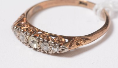 Lot 236 - A five stone diamond ring.